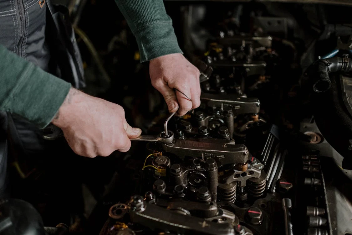 mechanic working on diesel engine